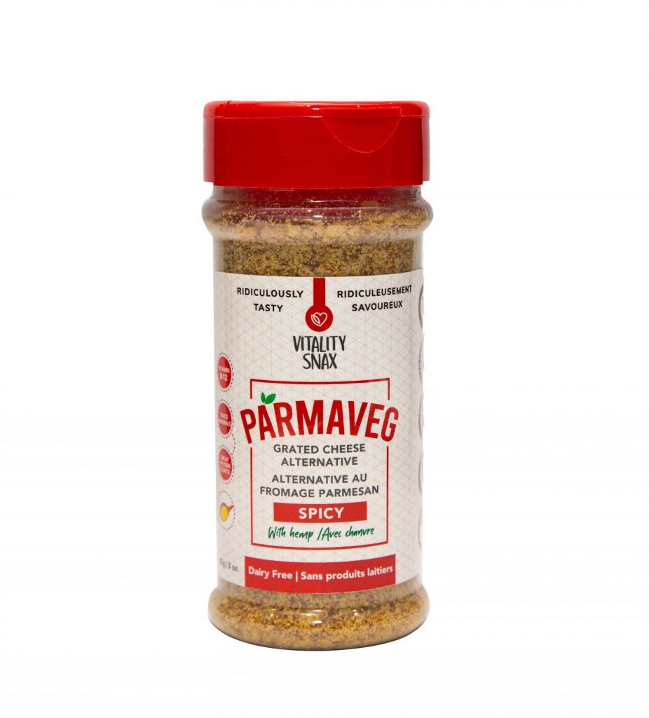 A jar of seasoning with the label " parmaves spicy ".